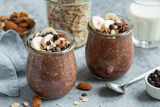 Chocolate overnight oats topped with banana and almonds
