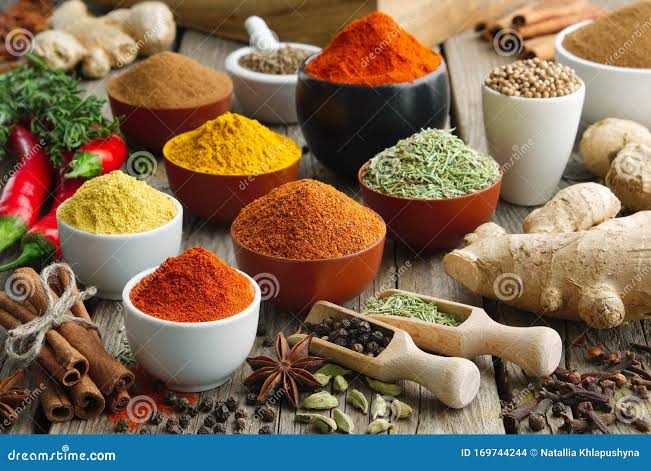 Bowls filled with colourful herbs and spices