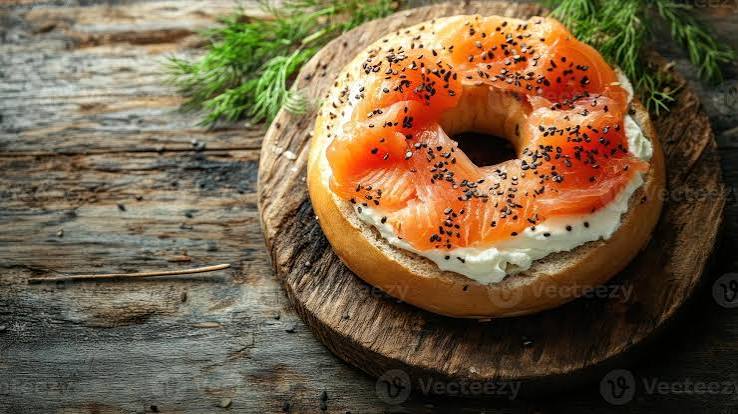 Wholemeal bagel topped with cream cheese and smoked salmon